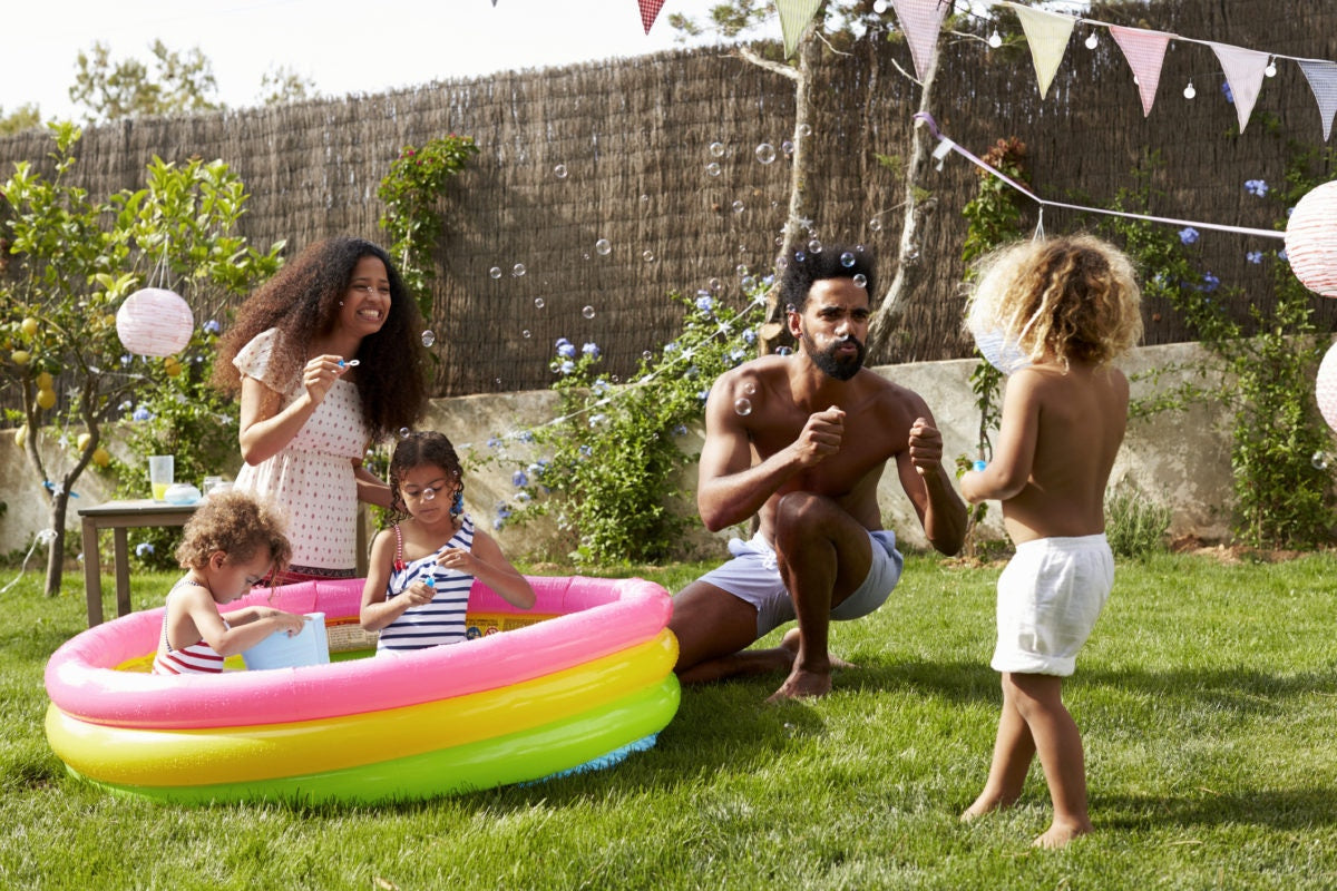 family playing with soap bubbles