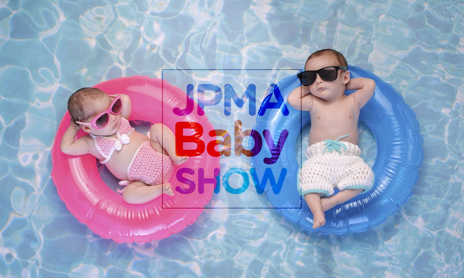 twin baby sister and brother sleeping on tiny, inflatable, pink and blue swim rings. They are wearing crocheted swimsuits and sunglasses.