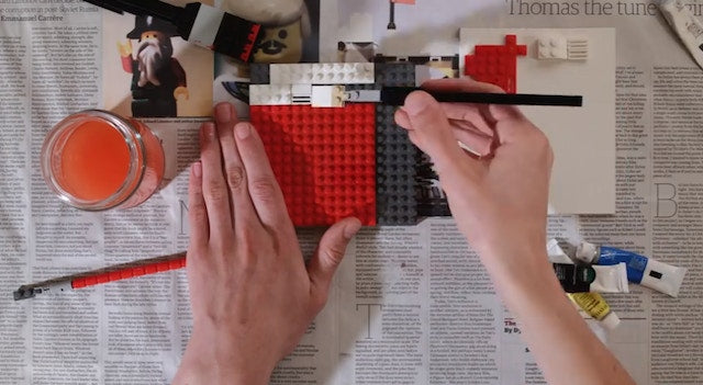 overhead image of building blocks being painted