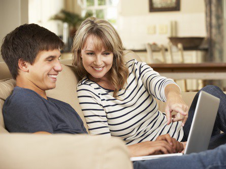 mom with sone looking at a computer