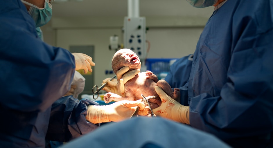 new born baby crying in the hospital