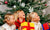 Three young happy girls with Christmas gifts