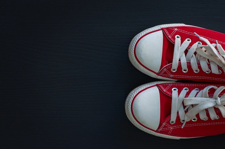 red and white colored sneakers