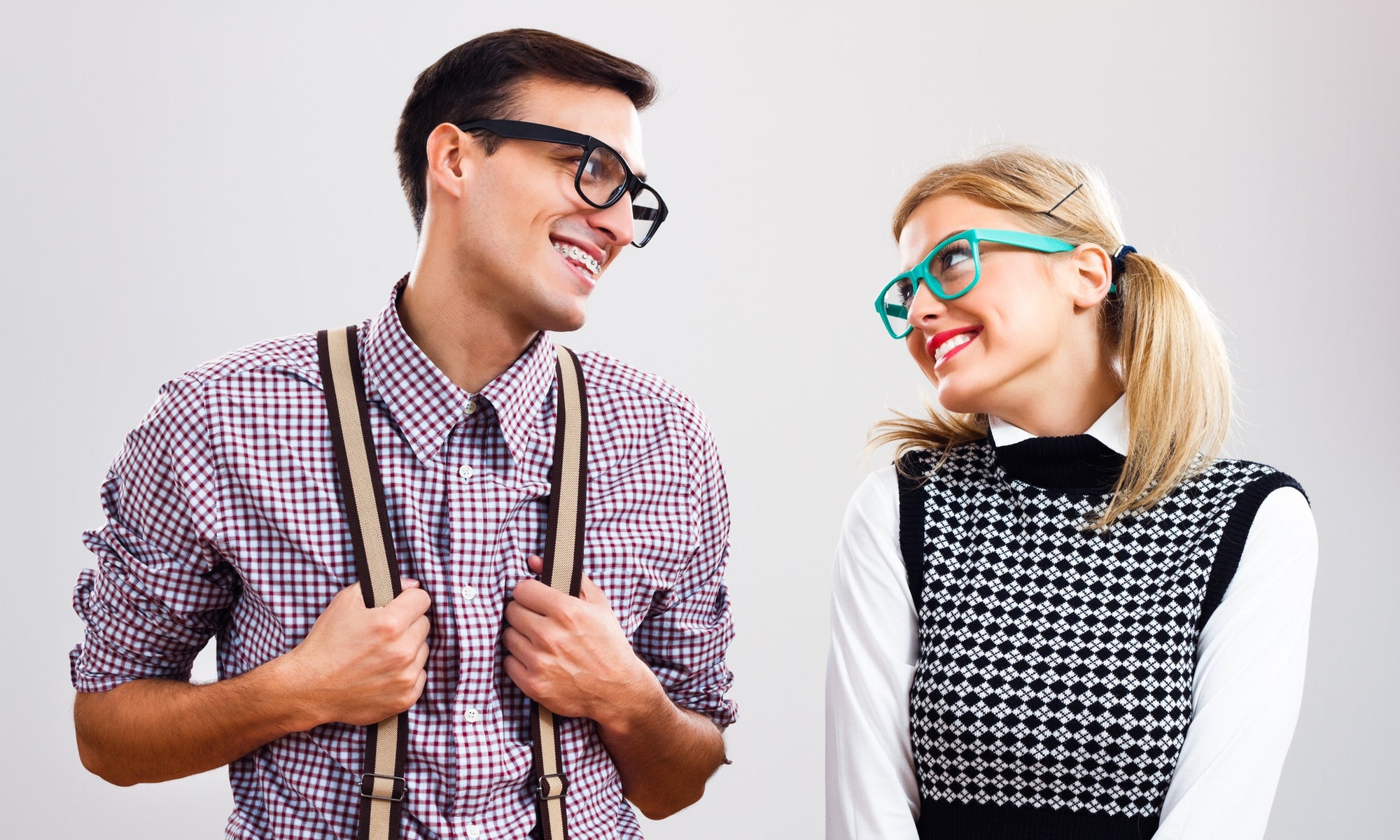 Young man and woman smiling at each other