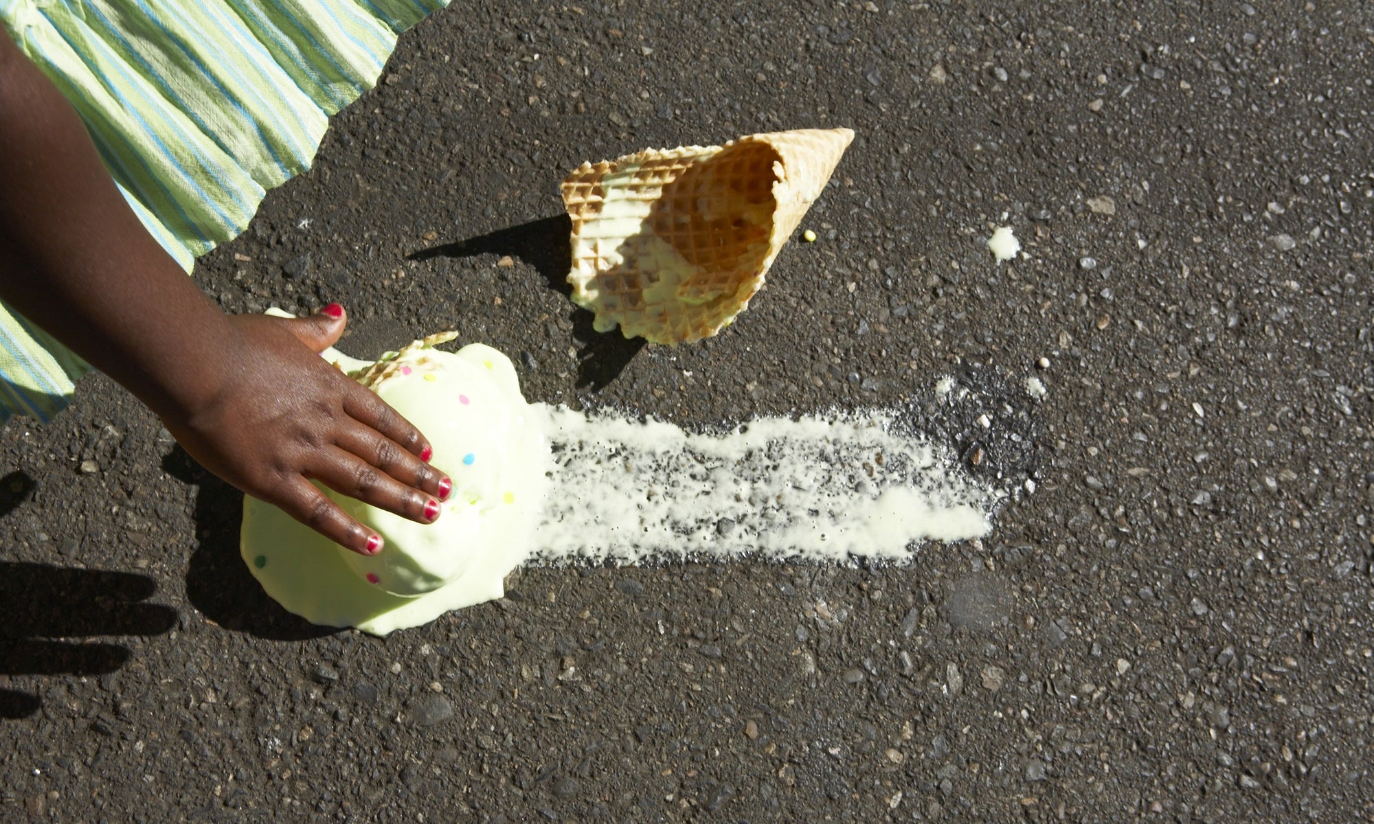 ice cream cone fell on the steet floor