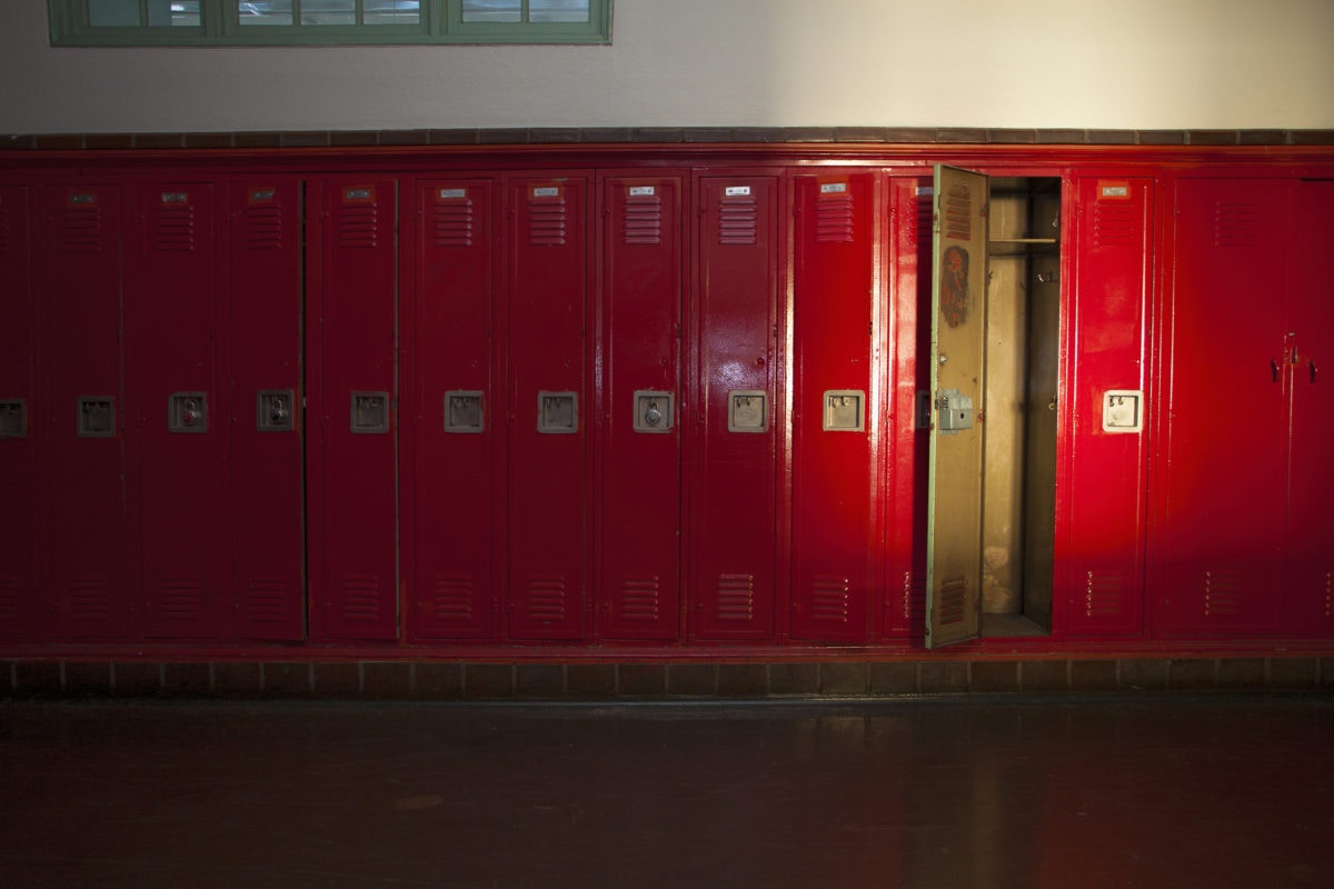 a locker room with one locker open