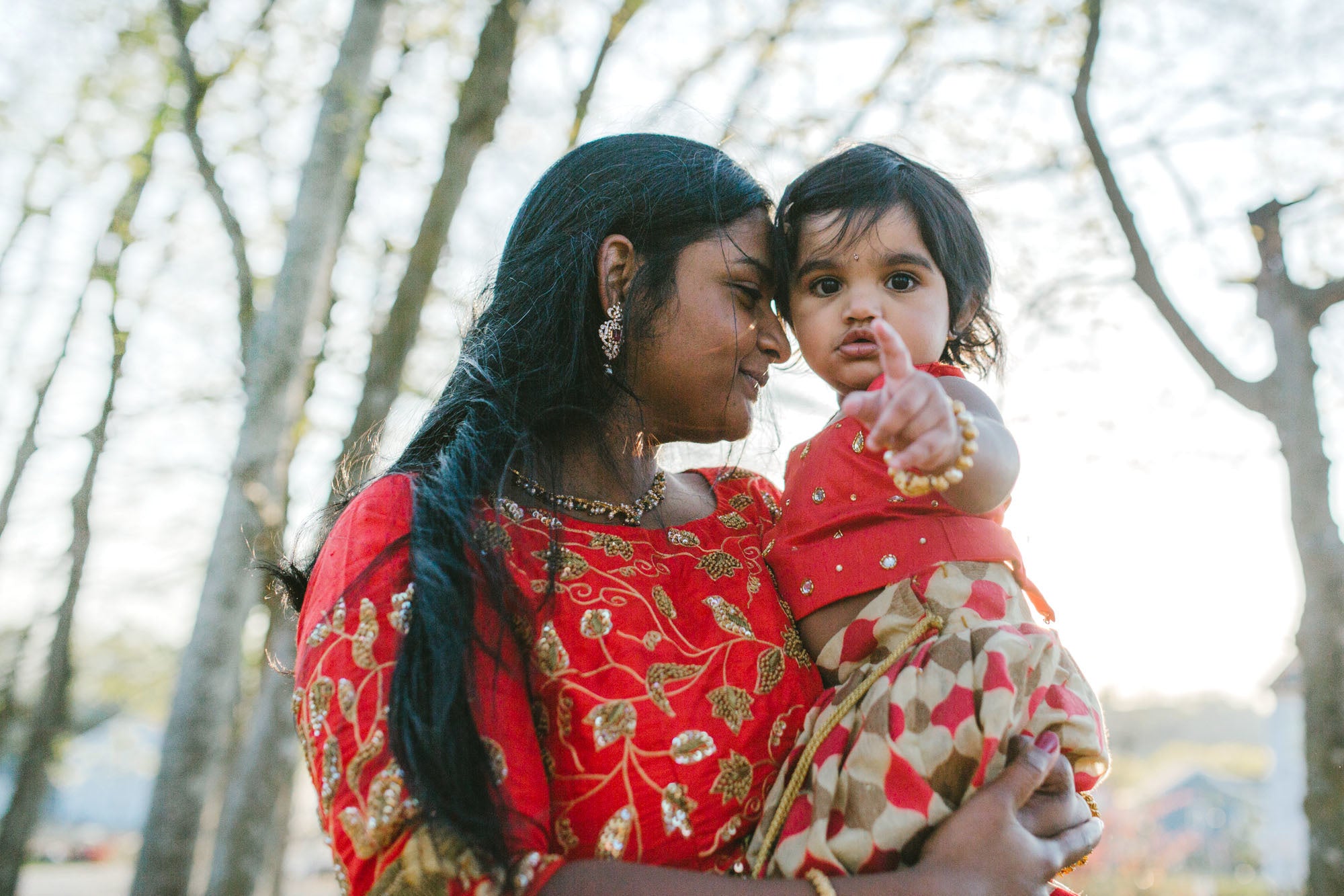 mother holding her daughter in her arms 