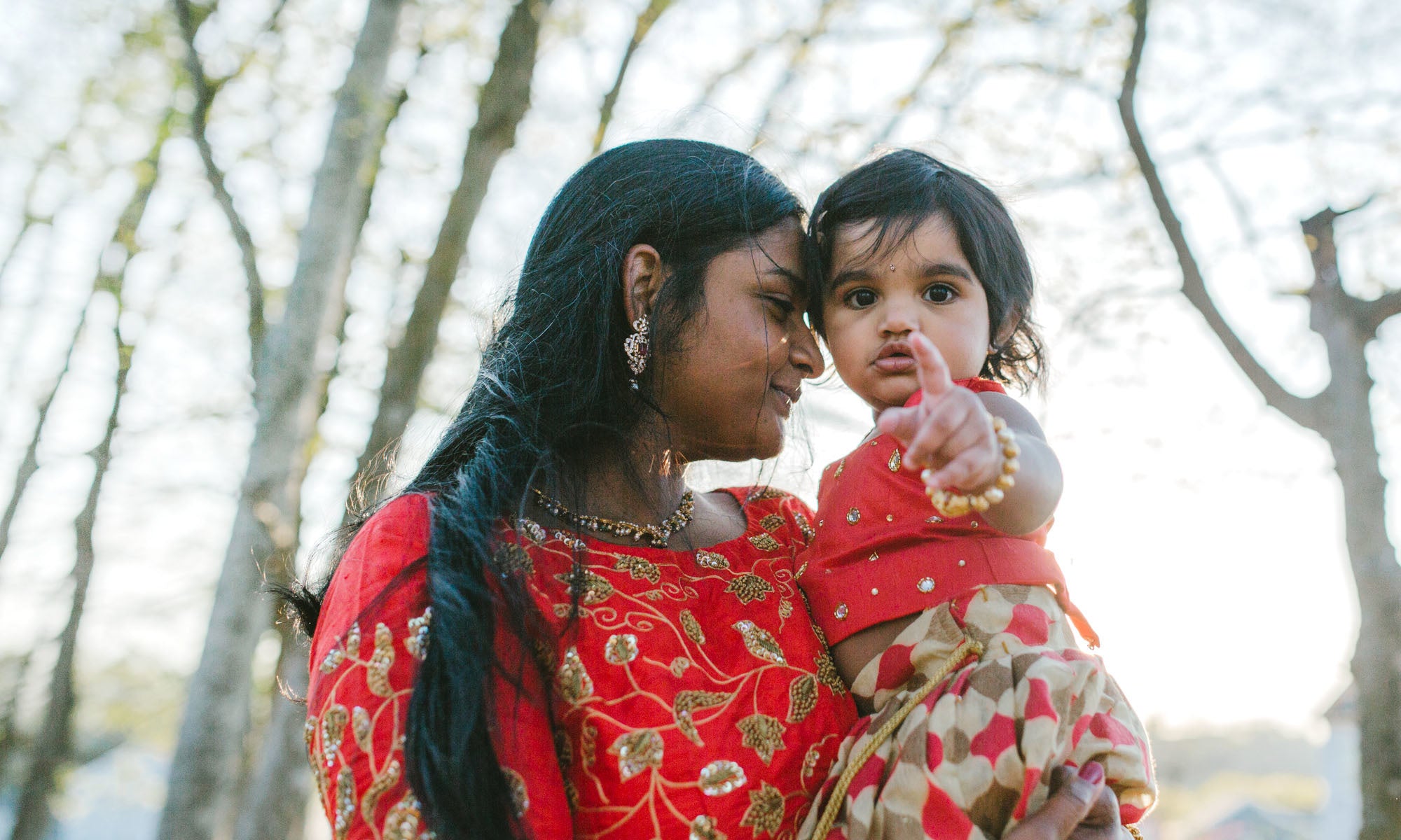 mother holding her daughter in her arms 