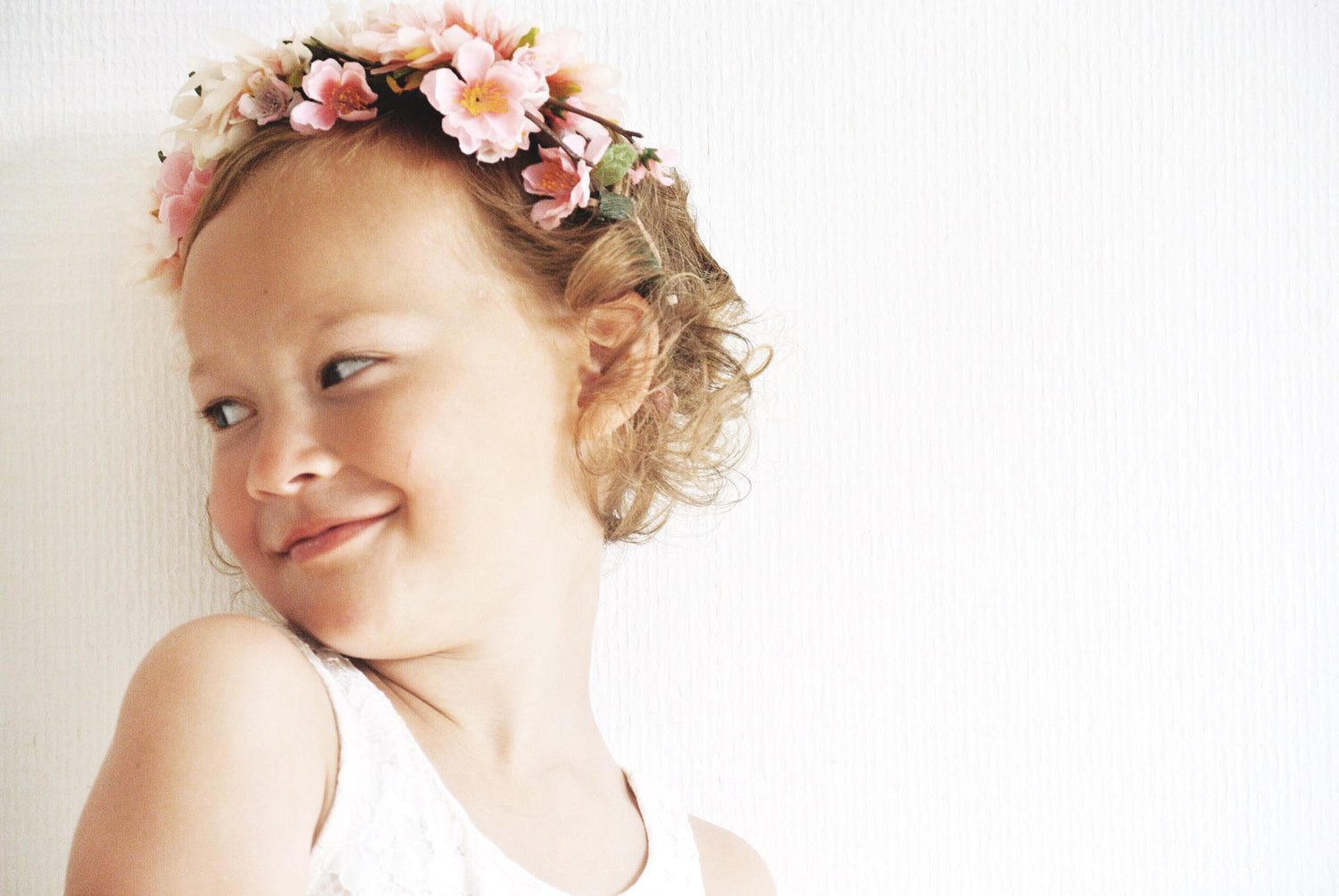 girl in white dress with flower crown