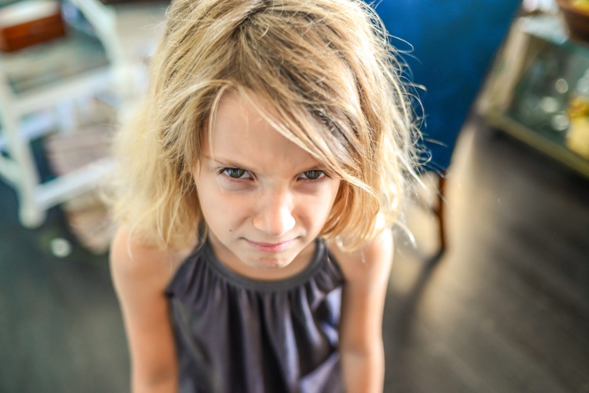 Irritated kid with blonde hair