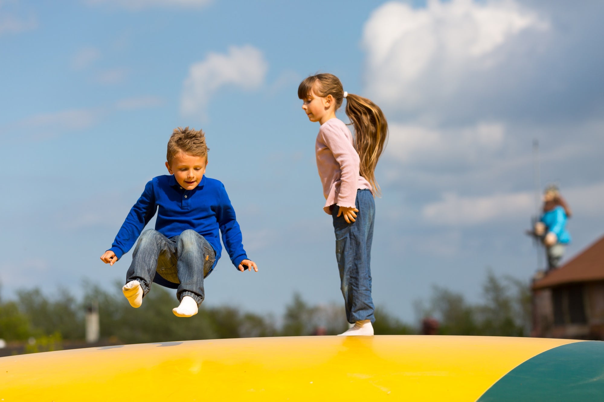 Kids bouncing in playground