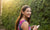 young girl with braces looking at camera smiling