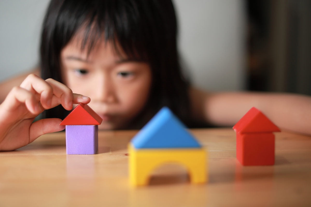 kid playing with blocks