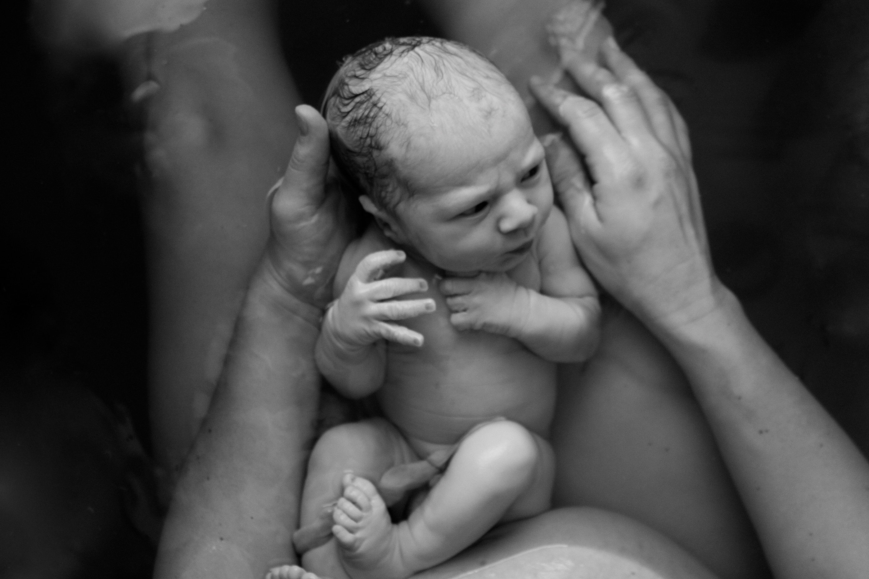 mother holding new born baby