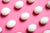 pink background with white eggs