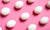 pink background with white eggs