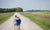 Two boys walking with arms around each other's shoulders