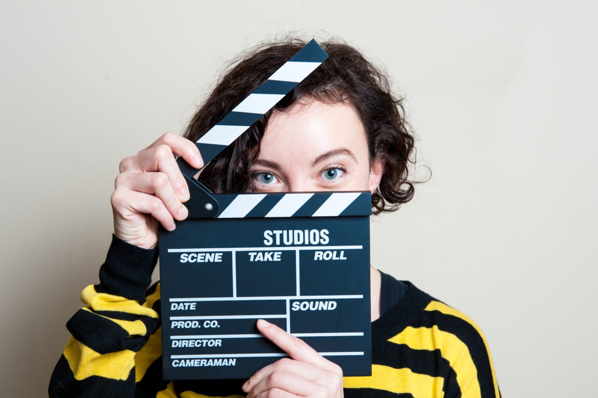 Woman is clapping for movie scene