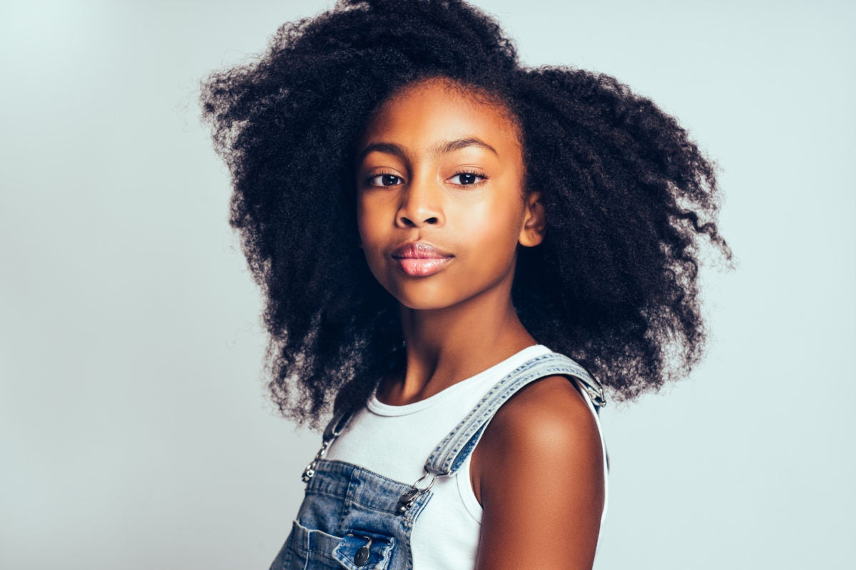 A kid with curly hair