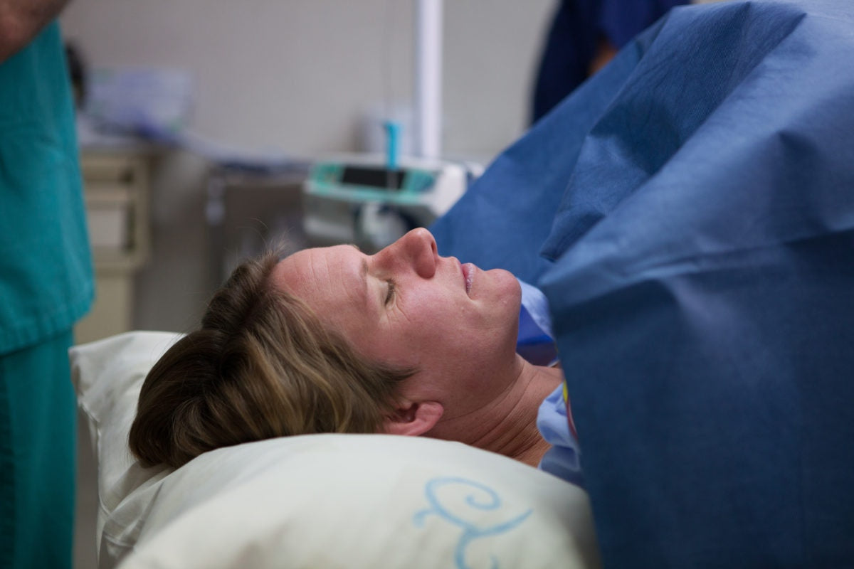 Pregnent woman giving birth to child in a hospital