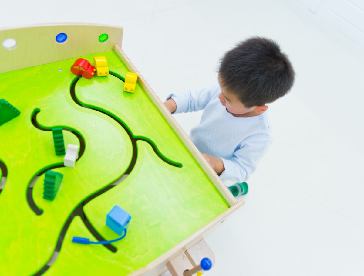 boy playing with toys