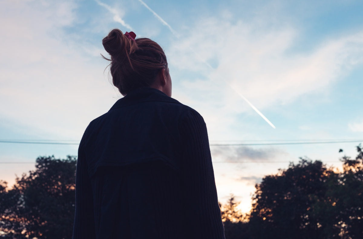 lady watching the comets in  sky.