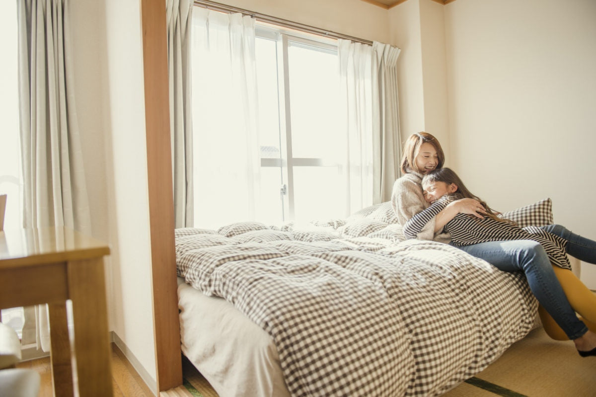 woman with a child in bed