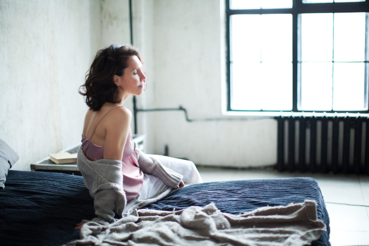 woman sitting in bed