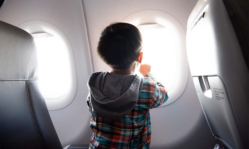 boy looking out the window