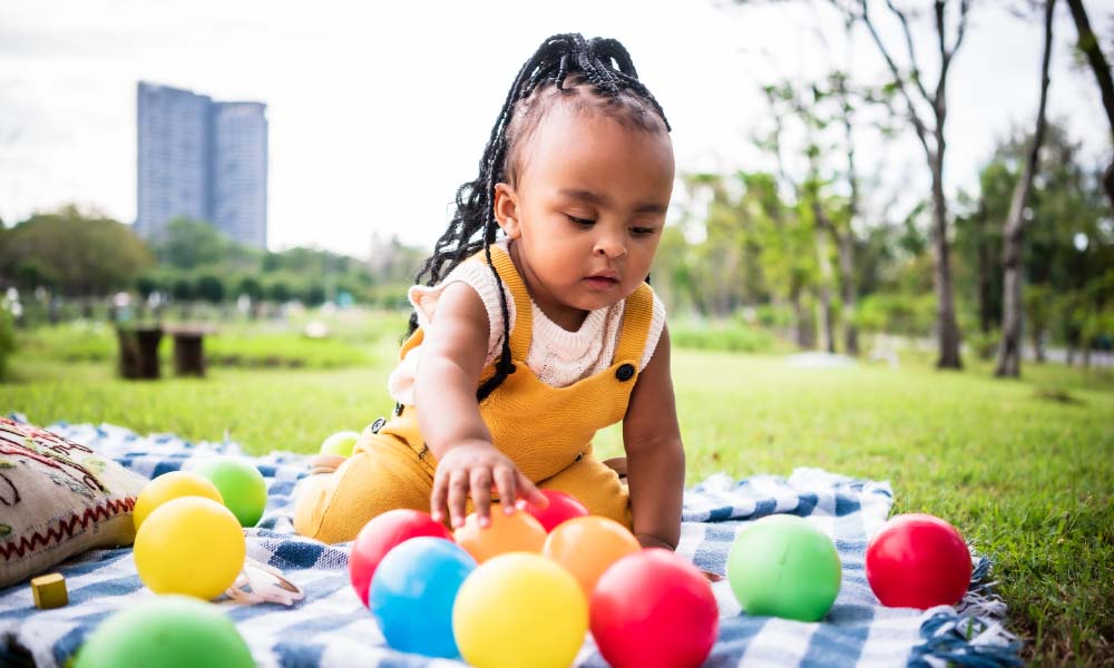 baby playing in a park