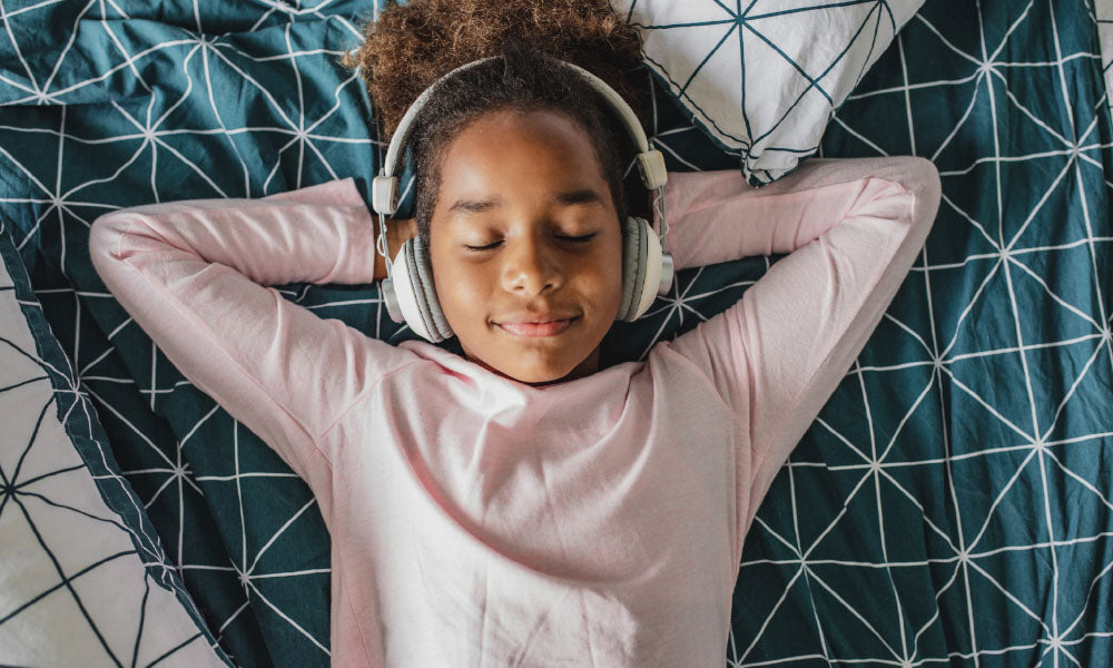 girl listening on her headphones