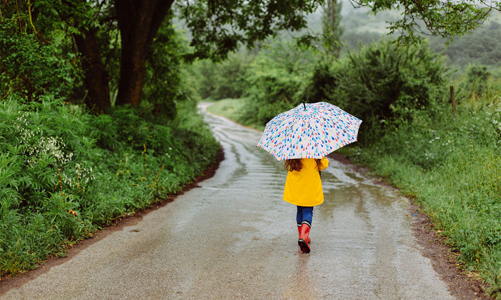 girl walking in the rain