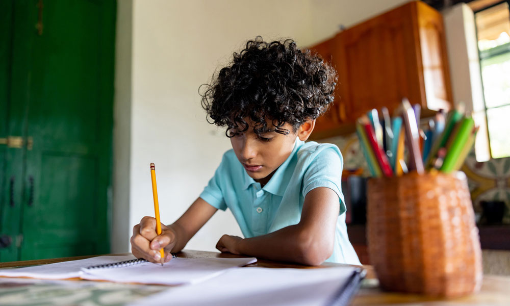 young boy doing his home work